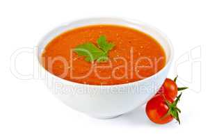 Soup tomato in white bowl with cherry tomatoes