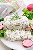 Terrine of curd and radishes in dish on board