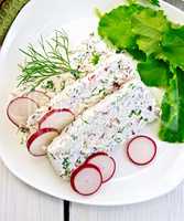 Terrine of curd and radishes in dish on board top