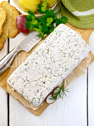 Terrine whole of curd and radish on paper and board top