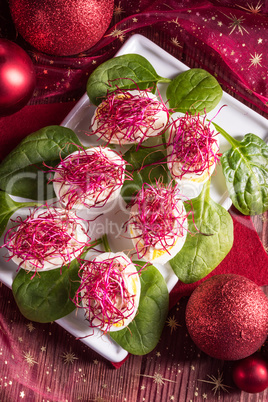 boiled eggs with red beet sprouts