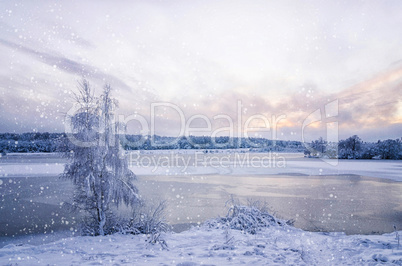 Winter landscape with lake and tree in the frost with falling sn