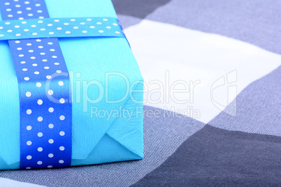 blue gift box with white ribbon