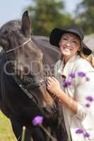 Woman in Black Hat Stroking Her Horse