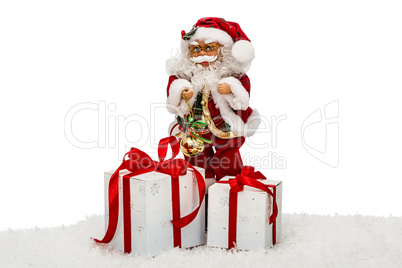 Santa Claus on snow with gift boxes - toy, isolated on white bac