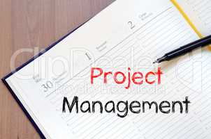 Project management write on notebook