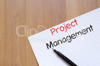 Project management write on notebook