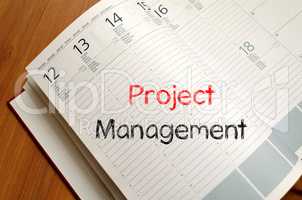 Project management write on notebook