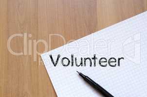 Volunteer write on notebook