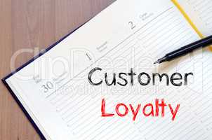 Customer loyalty write on notebook