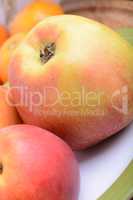 many different fruits for the health of the entire family, peach, mandarin, apple