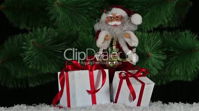 Santa Claus with gift boxes is dancing on a background of the Christmas tree, HD 1920х1080
