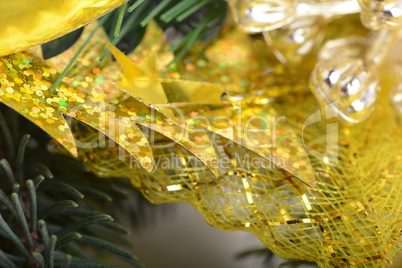 Image of Christmas tree branch with golden material, festive border, New Year greeting card, magic night, glowing backdrop, xmas decoration, holiday ornament