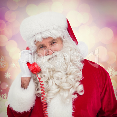 Composite image of santa claus on the phone