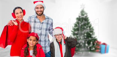 Composite image of happy family looking at camera