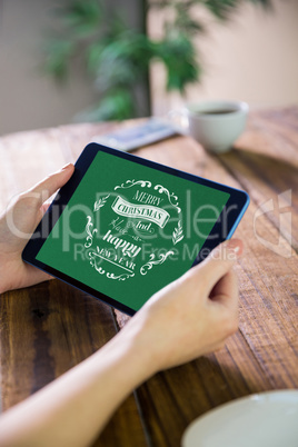 Composite image of woman using tablet pc