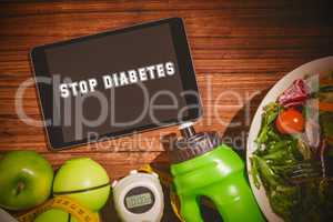 Stop diabetes against tablet on healthy persons table