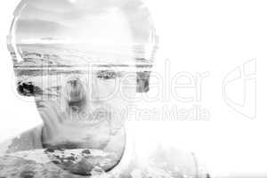 Young man with headphones and waterfall, double exposure