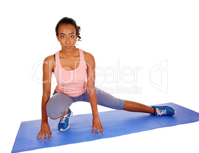 Beautiful African American woman stretching.