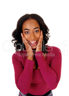 African woman with hands on face.