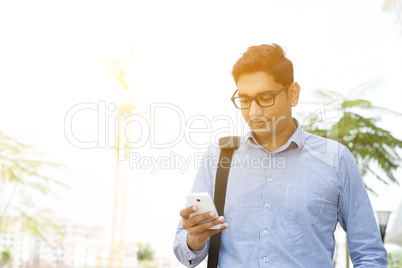 Indian business people texting using smartphone