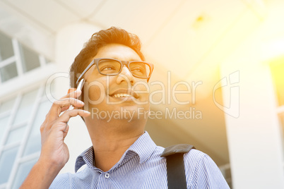 Indian business people talking on smartphone