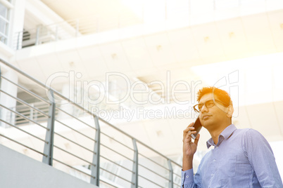 Indian businessman calling on smartphone