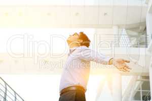 Asian Indian businessman arms outstretched