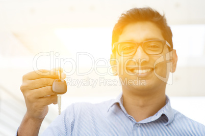 Man hand holding new car key