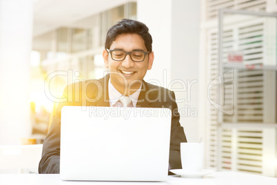 Business people using laptop pc at cafe