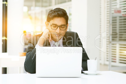 Business people using laptop computer at cafeteria