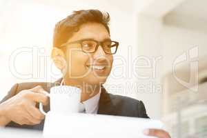 Business man using tablet pc at cafe