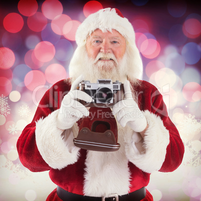 Composite image of santa is taking a picture