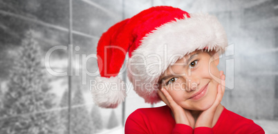 Composite image of festive little girl smiling at camera