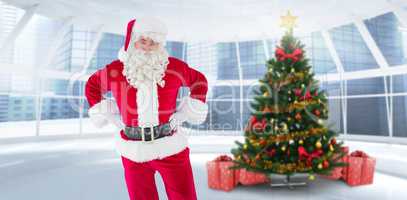 Composite image of cheerful santa claus with his hands on hips
