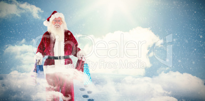 Composite image of santa carrying gifts