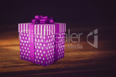 A purple Christmas gift with ribbon