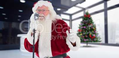 Composite image of santa claus is singing christmas songs