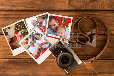 Composite image of senior man giving a kiss and a christmas present to his wife
