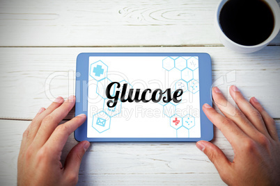 Glucose against person using tablet computer