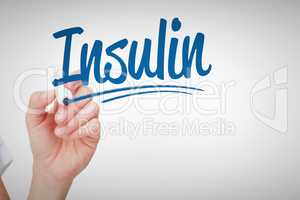 Insulin against female hand holding whiteboard marker
