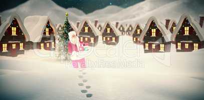 Composite image of father christmas holding many gifts