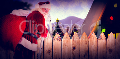 Composite image of santa steps up a ladder