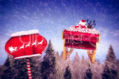 Composite image of silhouette of santa and reindeer