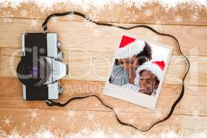 Composite image of mother and daughter opening a christmas gift