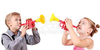 boy and little girl play trumpet