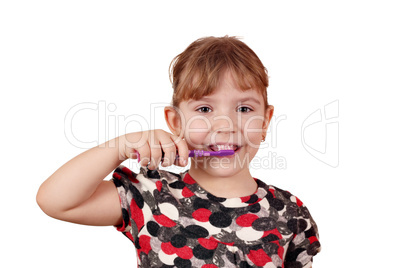 little girl brush their teeth