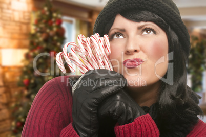 Woman Holding Candy Canes in Christmas Setting
