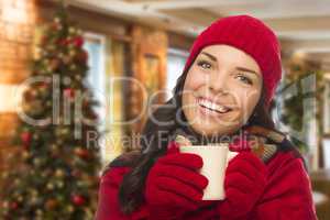 Mixed Race Woman Wearing Hat and Gloves In Christmas Setting