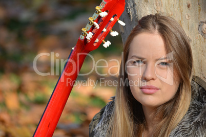 Blue eyed girl with guitar